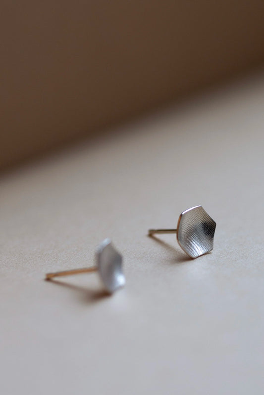 Hexagon Stud Earrings in Silver by Kei Tominaga