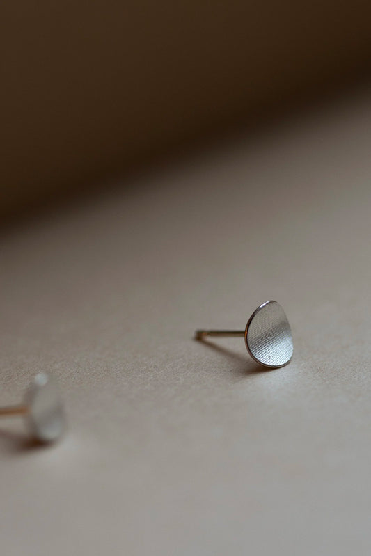 Circle Stud Earrings in Silver by Kei Tominaga