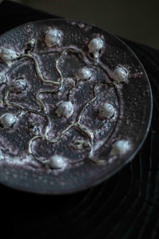 White Buds and Purple Plate by Kina Björklund