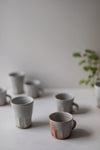 Shino Faceted Mugs by Tim Lake