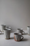 Shino Faceted Mugs by Tim Lake